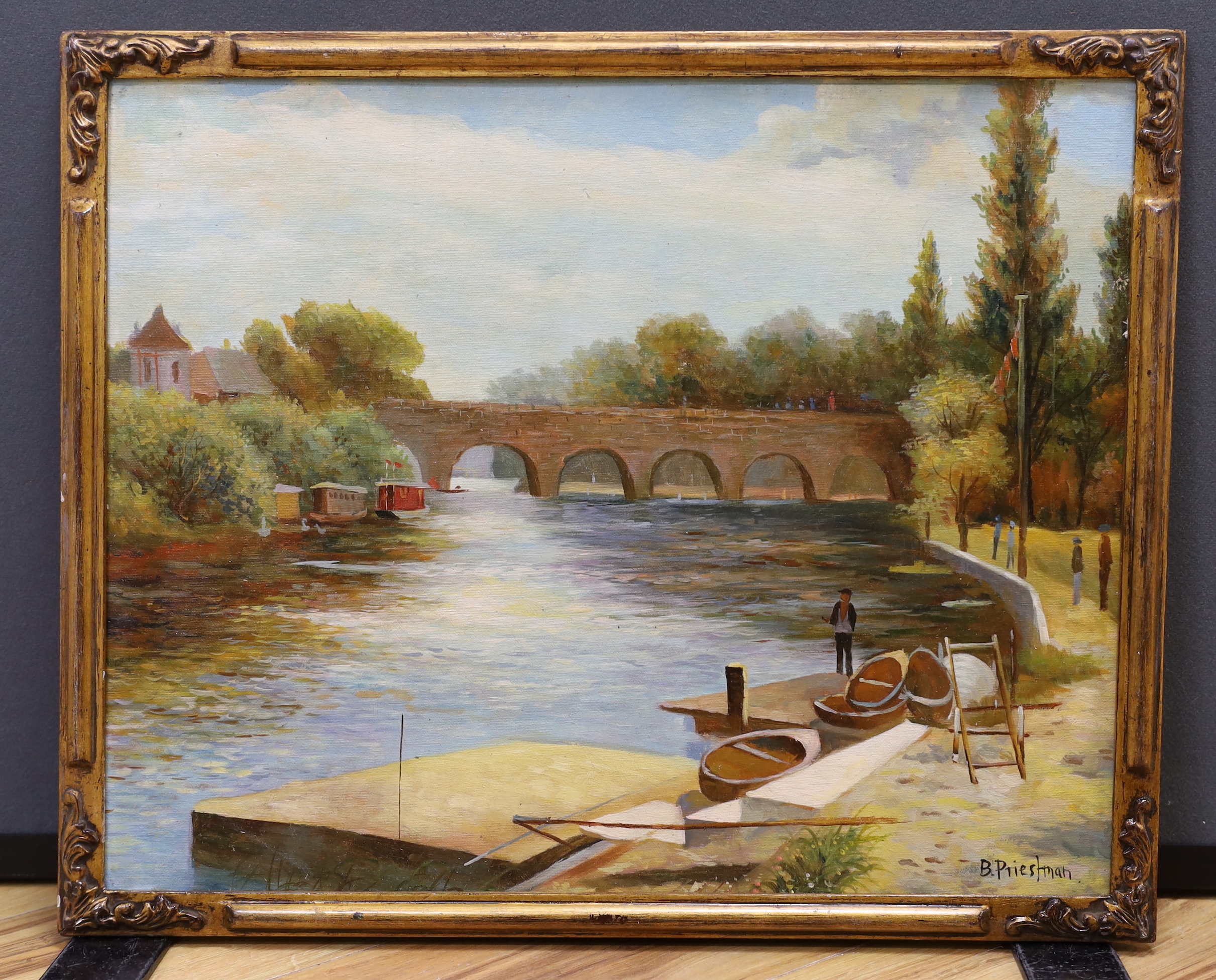After Bertram Priestman (1868–1951) oil on board, River landscape with bridge and rowing boats, 50 x 40cm